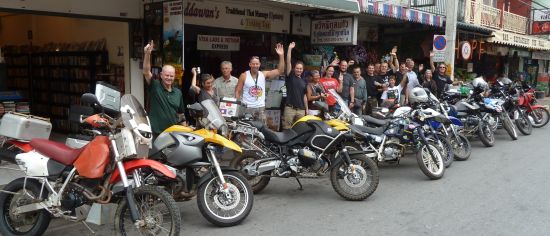 Some of the attendees brought their motorcycles fresh from the road to the meeting for a group photo.
