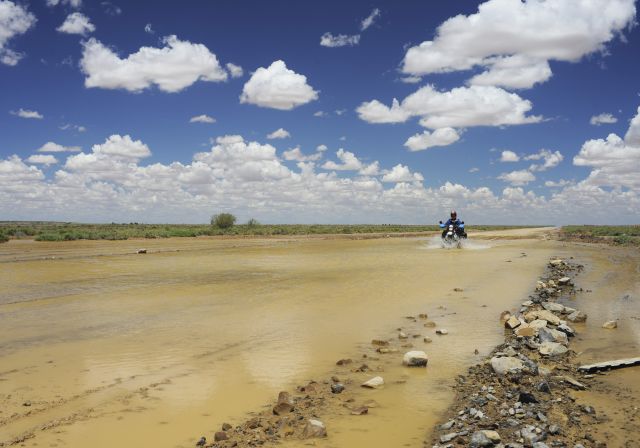 July: by Werner Steffens, Germany; of Claudia Sabel, Germany. Water crossing on the Oodnadatta Track/South Australia on our RTW; R80GS.