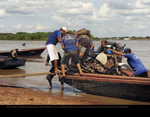 Photo by: Werner Steffens and Claudia Sabel, of Werner Steffens, Germany; Loading the bikes on a boat at the boardercrossing from Bolivia to Brazil, on our RTW trip, R100GS.