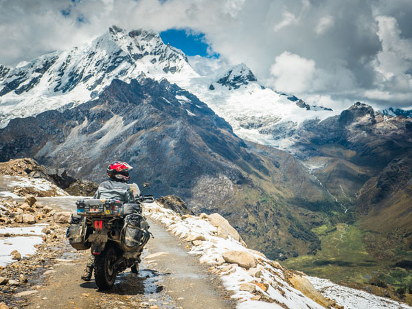 Photo of Duncan Cartwright by Tolga Basol (Turkey) - Punta Olimpica, Peru - Checking the gorgeous view during the Ride Must Go On RTW, 2015 - Triumph Tiger 800. www.ridemust.com.