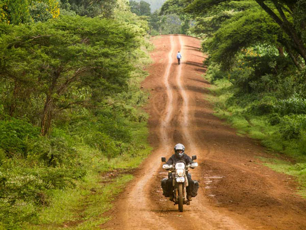 Photo by Danielle Murdoch (New Zealand) of Motomonkey Adventures riding to a small Kenya, Uganda border, hoping to avoid paying a Kenyan road tax on my Australia-to-Africa Adventure. 