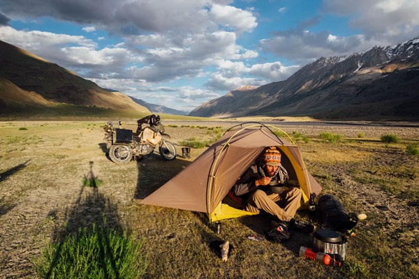 Photo by Michael Jordan (New Zealand) of himself enjoying a warm meal on a cold evening in the Zangskar Valley, Ladakh, IndiaKLR650 parked in the background.
