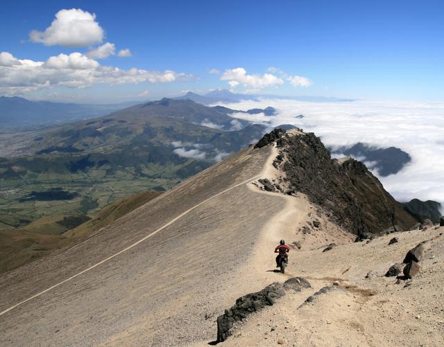 Tyson Brust, Canada; of Jose Rodriguez riding the rim of Guagua Pichincha volcano, Ecuador.