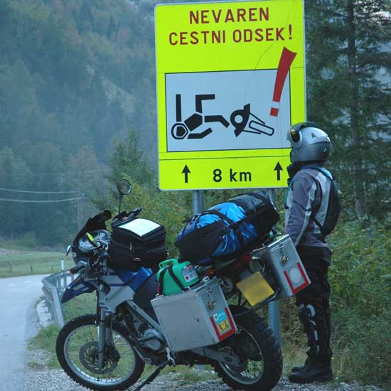 Spencer and a moto road sign