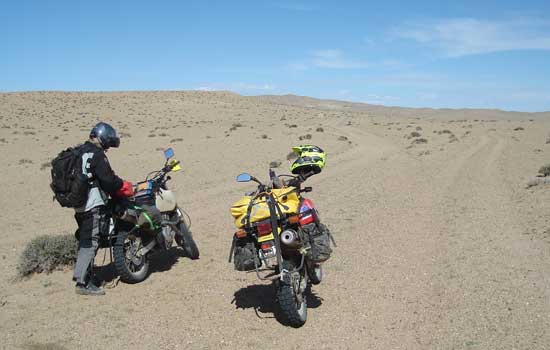 Michel riding on sand.