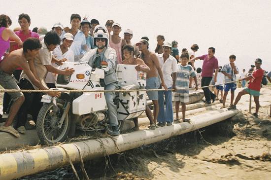 Grant Johnson on pipe bridge in Peru.