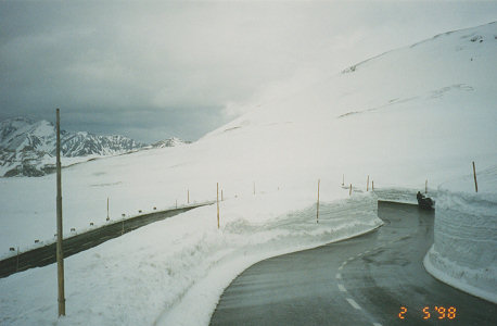 Deep cuttings of snow still on mountain passes