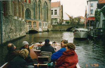 Canal tour through the old city buildings of Brugge