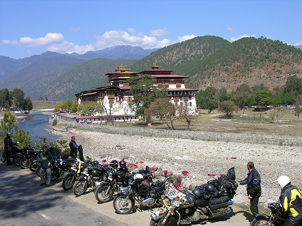 Photo line up of the motorcycles outside Punakha Dzong