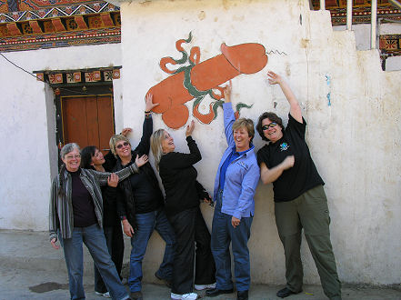 Female contingent admiring the fertility symbol seen painted on many houses
