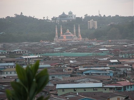 Brunei Mosque at night behind Kampung Ayer, the stilt housed water village