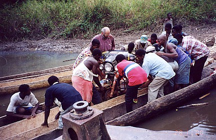 River crossing requiring three dug out canoes for stability