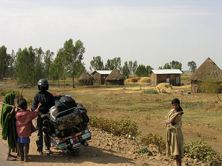 Children opportunistically begging each time we stop the bike