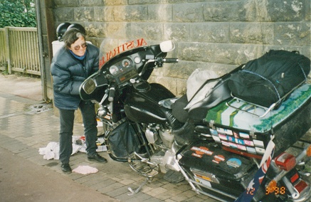 Fitting a new speedometer cable roadside, under a bridge, in the rain