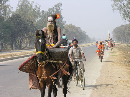 Hindu holyman and his followers on a pilgrimage to Varanassi