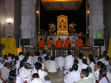 Sri Lankan Buddhists reciting Buddha's first sermon