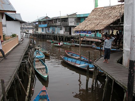 Canal dwelling on stilt houses and wooden boardwalks in Pontianak