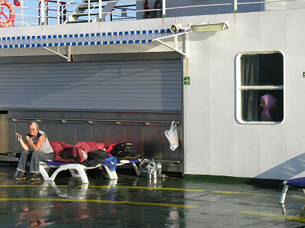 Listening to satellite radio on the ship from our on deck chairs bed 