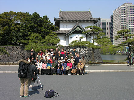 Bus group posing for a photo outside the Imperial Palace Tokyo