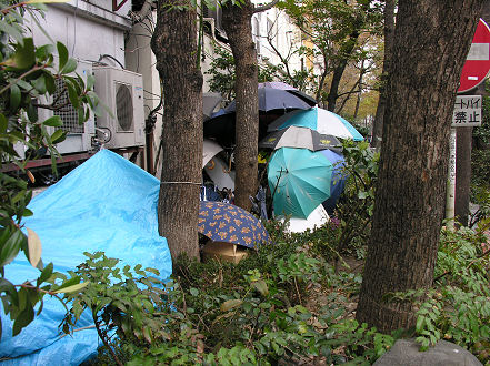 Where the other half live under tarps or umbrellas in snow and rain