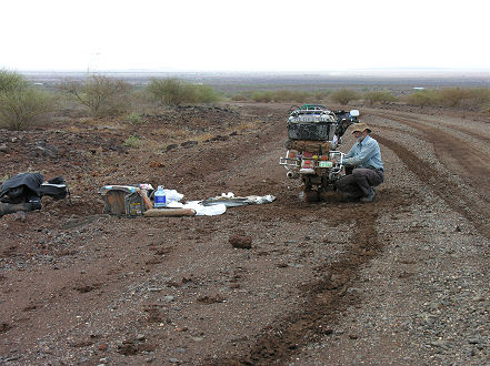 Changing another belt, roadside, in the mud.