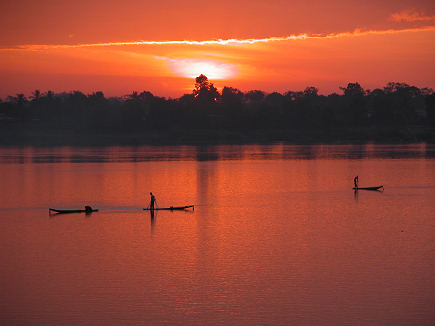 Sunrise over the Mekong with fishing boats up early