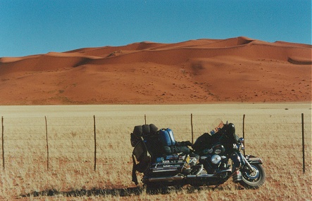 Golden grasslands and red sand dunes