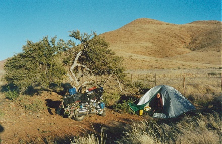 Camped on the thin line between fence and road