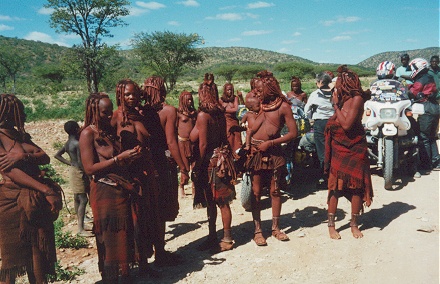 Traditional living Himba people, seen here and also shopping, still traditionally dressed