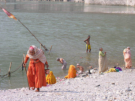 The elderly, bathing at two rivers confluence, Devghat