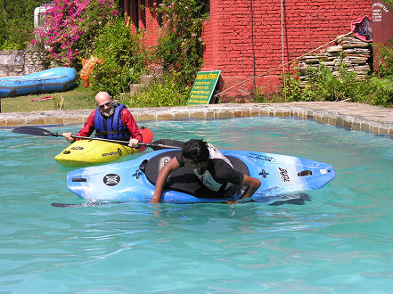 Practising an eskimo roll in the Sukute Beach pool