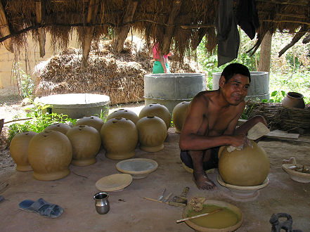 Making clay bowls for rakshi, the local home made wine