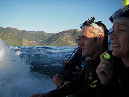 Sitting on the boats backboard waiting to get in the water