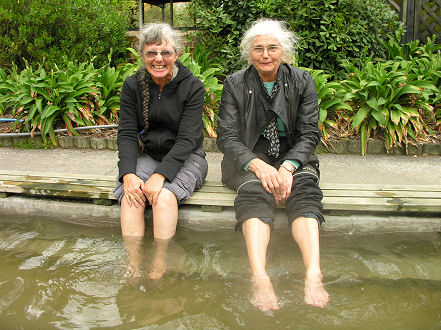 Kay and Rita warming their feet in the hot pools