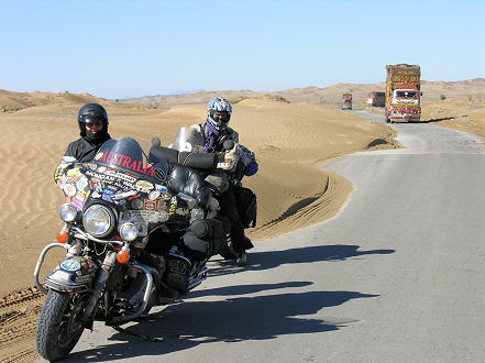 Trucks along the narrow road to Quetta with sand drifts