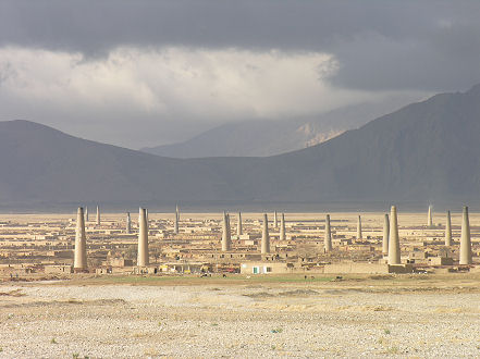 Brick kilns out of Quetta with a mountain storm brewing