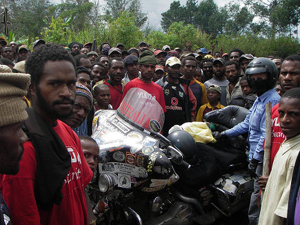 Large crowd gathered to look at the motorcycle at the singsing