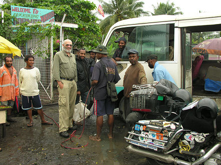 Air for the rear tyre at a roadside stop, Lae