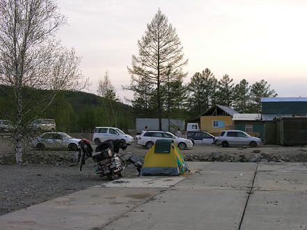 Camped next to a makeshift restaurant and tyre repair place with the Japanese import cars 