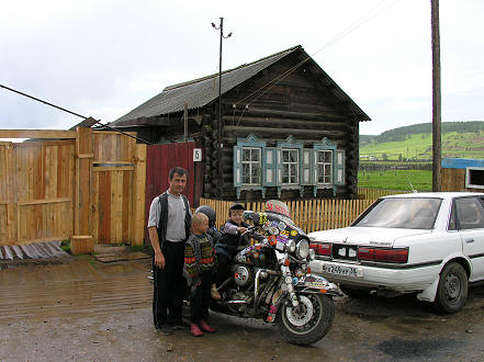 Small log house where I was invited to lunch after repairing the engine mount bolts