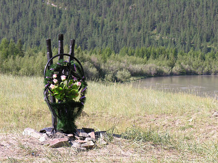 Memorial roadside to a road accident victim. Note the steering wheel and drive shafts incorporated