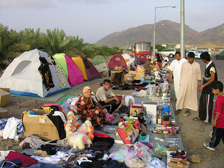 Russian pilgrims to Mecca selling items to help pay for the trip