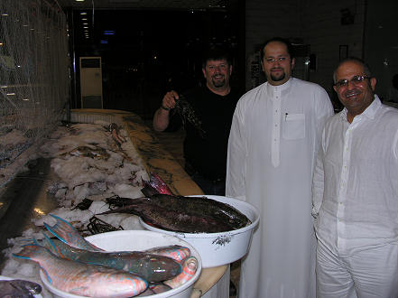 Selecting the fish for dinner with Said and Sulaiman