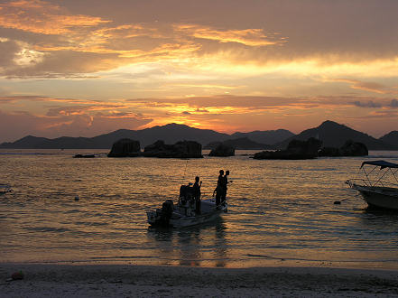 Local boys fishing at sunset