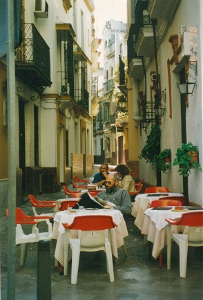 Relaxing in a Seville streetside restaurant