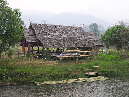 Restaurant and raft at a riverside bungalow in Pai