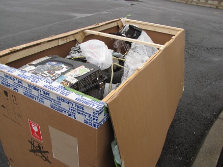 Uncrating the motorcycle in the carpark at Newark Airport
          Cargo