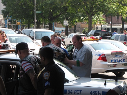 The two arrested Hells Angels are placed into a police
          vehicle