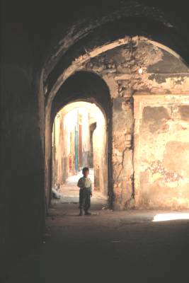 Boy in archway, old town of Tripoli.
