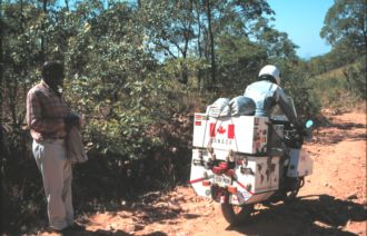 Grant watched by amused local on road back down from Livingstonia.